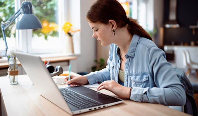 Teenage girl doing homework.